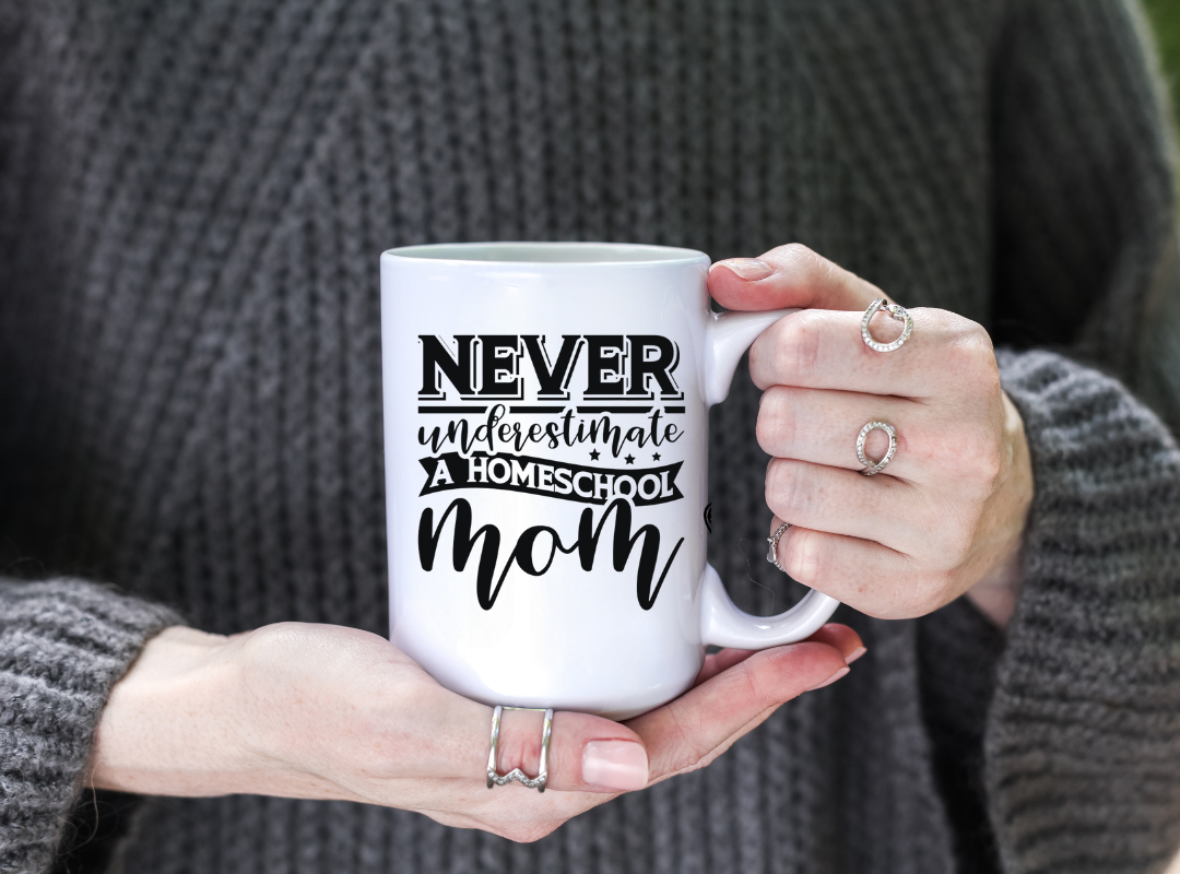 Never Underestimate A Homeschool Mom coffee / tea mug